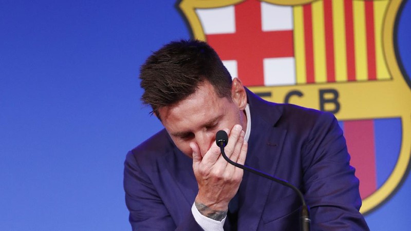 Lionel Messi cries at the start of a press conference at the Camp Nou stadium in Barcelona, Spain, Sunday, Aug. 8, 2021. FC Barcelona had previously announced the negotiations with Lionel Messi had ended and that Messi would be leaving the club. (AP Photo/Joan Monfort)