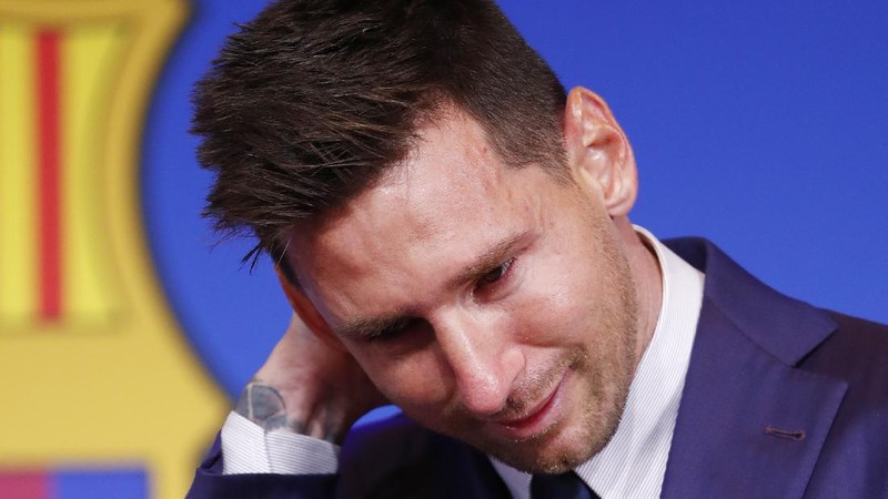 Lionel Messi cries at the start of a press conference at the Camp Nou stadium in Barcelona, Spain, Sunday, Aug. 8, 2021. FC Barcelona had previously announced the negotiations with Lionel Messi had ended and that Messi would be leaving the club. (AP Photo/Joan Monfort)