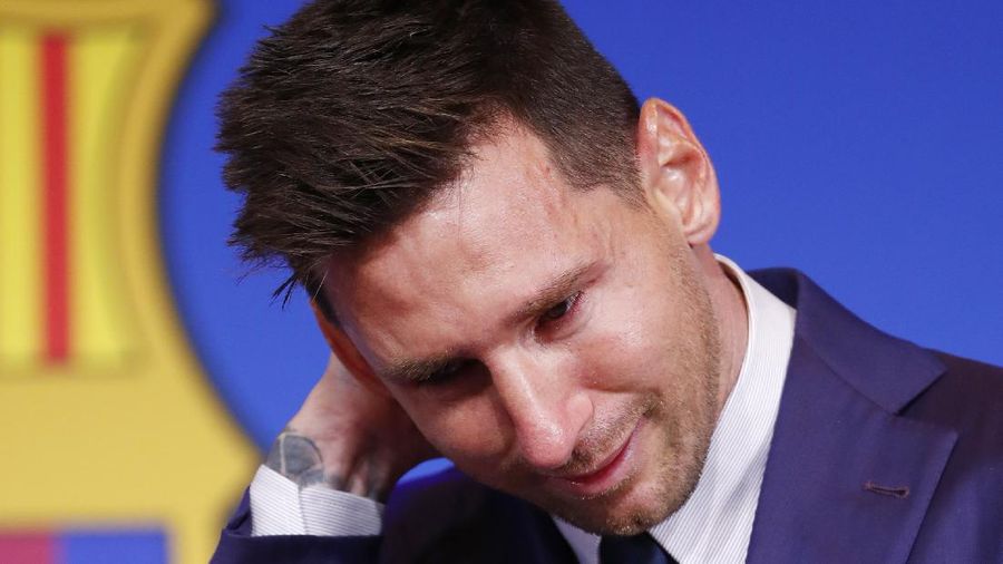 Lionel Messi cries at the start of a press conference at the Camp Nou stadium in Barcelona, Spain, Sunday, Aug. 8, 2021. FC Barcelona had previously announced the negotiations with Lionel Messi had ended and that Messi would be leaving the club. (AP Photo/Joan Monfort)