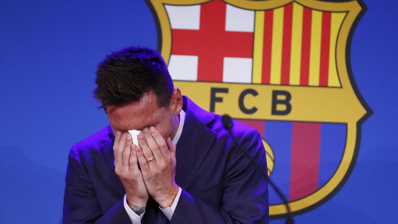 Lionel Messi cries at the start of a press conference at the Camp Nou stadium in Barcelona, Spain, Sunday, Aug. 8, 2021. FC Barcelona had previously announced the negotiations with Lionel Messi had ended and that Messi would be leaving the club. (AP Photo/Joan Monfort)