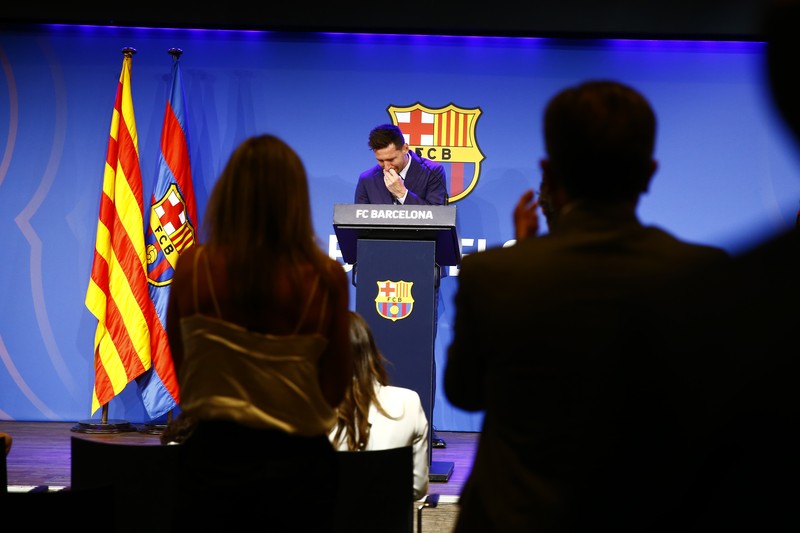 Spain Soccer Barcelona Messi Lionel Messi cries at the start of a press conference at the Camp Nou stadium in Barcelona, Spain, Sunday, Aug. 8, 2021. FC Barcelona had previously announced the negotiations with Lionel Messi had ended and that Messi would be leaving the club. (AP Photo/Joan Monfort)