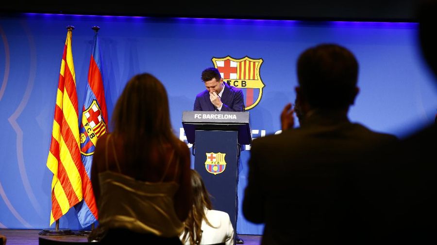 Lionel Messi cries at the start of a press conference at the Camp Nou stadium in Barcelona, Spain, Sunday, Aug. 8, 2021. FC Barcelona had previously announced the negotiations with Lionel Messi had ended and that Messi would be leaving the club. (AP Photo/Joan Monfort)