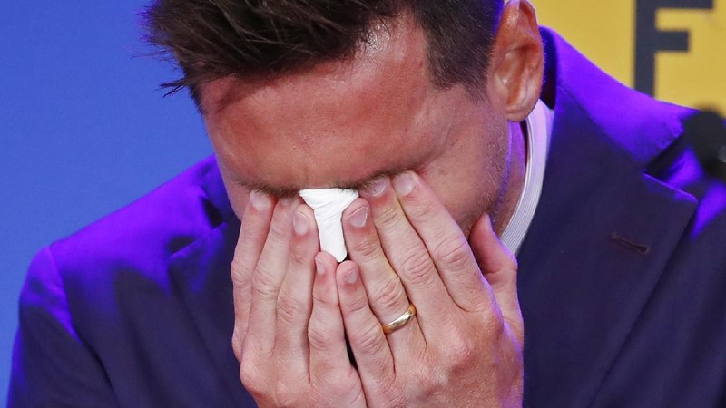 Lionel Messi cries at the start of a press conference at the Camp Nou stadium in Barcelona, Spain, Sunday, Aug. 8, 2021. FC Barcelona had previously announced the negotiations with Lionel Messi had ended and that Messi would be leaving the club. (AP Photo/Joan Monfort)
