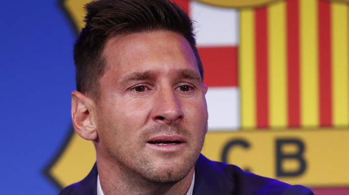 Lionel Messi smiles at the end of a press conference at the Camp Nou stadium in Barcelona, Spain, Sunday, Aug. 8, 2021. FC Barcelona had previously announced the negotiations with Lionel Messi had ended and that Messi would be leaving the club. (AP Photo/Joan Monfort)