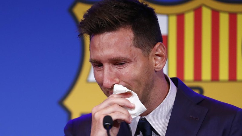 Lionel Messi cries at the start of a press conference at the Camp Nou stadium in Barcelona, Spain, Sunday, Aug. 8, 2021. FC Barcelona had previously announced the negotiations with Lionel Messi had ended and that Messi would be leaving the club. (AP Photo/Joan Monfort)