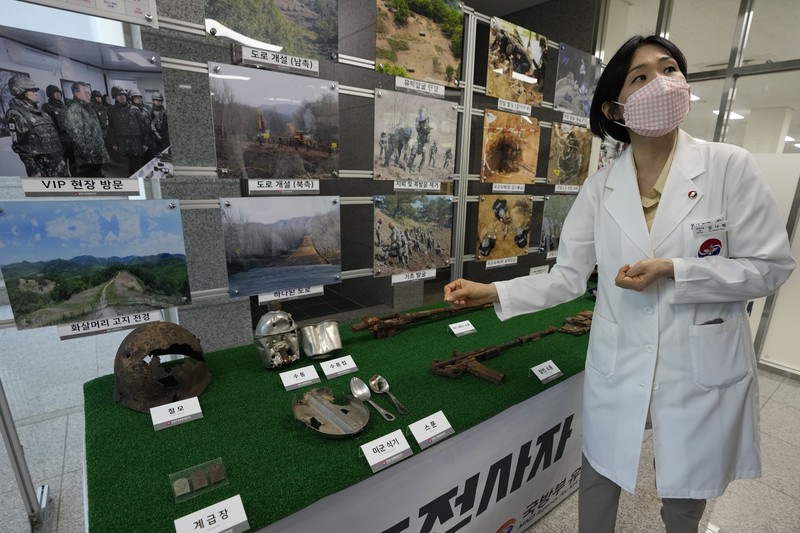 Lee Kyu-chang, a member of the central identification laboratory at the Ministry of National Defense Agency for Killed in Action Recovery & Identification, watches a screen showing dental X-rays of an unidentified soldier killed during the Korean War at the National Cemetery in Seoul, South Korea on July 26, 2021. The Korean War ended 68 years ago, but South Korea is still trying to recover its soldiers' remains. (AP Photo/Ahn Young-joon)