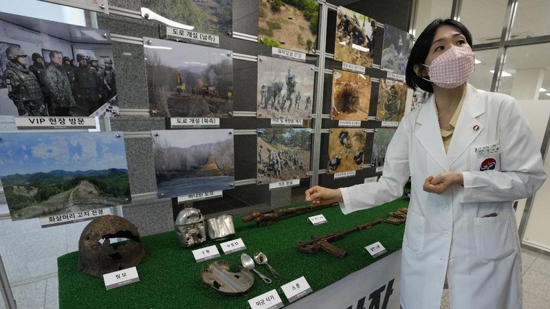 Lee Kyu-chang, a member of the central identification laboratory at the Ministry of National Defense Agency for Killed in Action Recovery & Identification, watches a screen showing dental X-rays of an unidentified soldier killed during the Korean War at the National Cemetery in Seoul, South Korea on July 26, 2021. The Korean War ended 68 years ago, but South Korea is still trying to recover its soldiers' remains. (AP Photo/Ahn Young-joon)