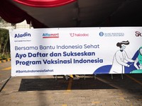 OJK - BI Dukung Vaksinasi Bank Aladin, Alfamart & Halodoc