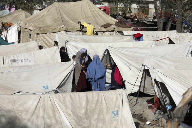 Afghanistan Internally displaced Afghans from northern provinces, who fled their home due to fighting between the Taliban and Afghan security personnel, take refuge in a public park Kabul, Afghanistan, Friday, Aug. 13, 2021. The Taliban have completed their sweep of the country's south on Friday, as they took four more provincial capitals in a lightning offensive that is gradually encircling Kabul, just weeks before the U.S. is set to officially end its two-decade war. (AP Photo/Rahmat Gul)