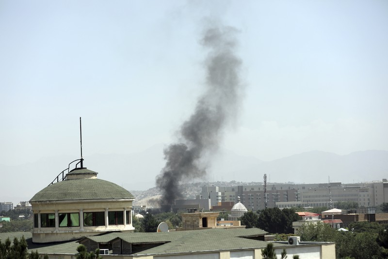 Afghanistan Anti-missile decoy flares are deployed as U.S. Black Hawk military helicopters and a dirigible balloon fly over the city of Kabul, Afghanistan, Sunday, Aug. 15, 2021. Taliban fighters entered the outskirts of the Afghan capital on Sunday and said they were awaiting a “peaceful transfer” of the city after promising not to take it by force, but amid the uncertainty panicked workers fled government offices and helicopters landed at the U.S. Embassy. (AP Photo/Rahmat Gul)