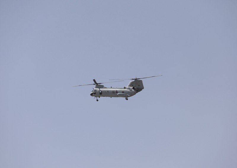 Afghanistan Anti-missile decoy flares are deployed as U.S. Black Hawk military helicopters and a dirigible balloon fly over the city of Kabul, Afghanistan, Sunday, Aug. 15, 2021. Taliban fighters entered the outskirts of the Afghan capital on Sunday and said they were awaiting a “peaceful transfer” of the city after promising not to take it by force, but amid the uncertainty panicked workers fled government offices and helicopters landed at the U.S. Embassy. (AP Photo/Rahmat Gul)