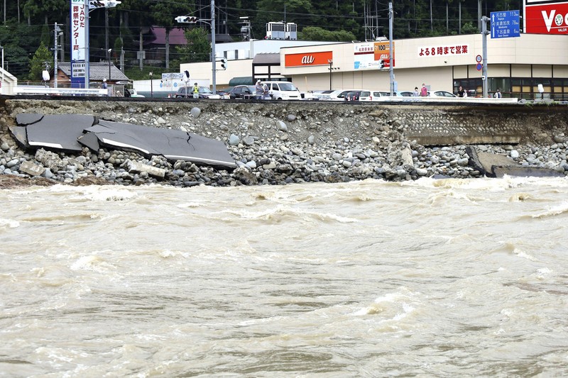 Japan Heavy Rain Roads are submerged in water after torrential rain in Takeo, Saga prefecture, southwestern Japan, Sunday, Aug. 15, 2021. Heavy rain has dumped on southwestern Japan since last week. (Kyodo News via AP)