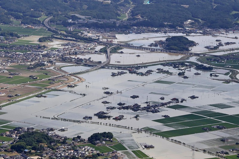 Japan Heavy Rain Roads are submerged in water after torrential rain in Takeo, Saga prefecture, southwestern Japan, Sunday, Aug. 15, 2021. Heavy rain has dumped on southwestern Japan since last week. (Kyodo News via AP)