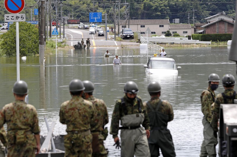 Japan Heavy Rain Roads are submerged in water after torrential rain in Takeo, Saga prefecture, southwestern Japan, Sunday, Aug. 15, 2021. Heavy rain has dumped on southwestern Japan since last week. (Kyodo News via AP)