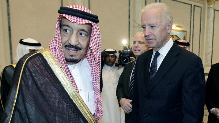 FILE - In this Oct. 27, 2011 file photo, then U.S. Vice President Joe Biden, right, offers his condolences to then Prince Salman bin Abdel-Aziz upon the death of his brother Saudi Crown Prince Sultan bin Abdul-Aziz Al Saud, at Prince Sultan palace in Riyadh, Saudi Arabia. President Joe Biden is expected to speak to Saudi King Salman for the first time in Biden’s just over a month-old administration. Coming as soon as Thursday, the conversation between the two strategic partners will be overshadowed by the expected release of U.S. intelligence findings on whether the king’s son approved the killing of a U.S.-based Saudi journalist.  (AP Photo/Hassan Ammar)