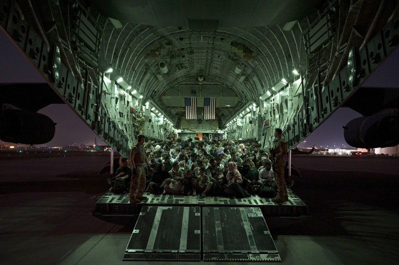US Afghanistan In this Aug. 20, 2021, photo provided by the U.S. Marine Corps, U.S. Marines and Norweigian coalition forces assist with security at an Evacuation Control Checkpoint ensuring evacuees are processed safely during an evacuation at Hamid Karzai International Airport in Kabul, Afghanistan. (Staff Sgt. Victor Mancilla/U.S. Marine Corps via AP)