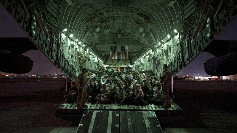 In this Aug. 20, 2021, photo provided by the U.S. Marine Corps, U.S. Marines and Norweigian coalition forces assist with security at an Evacuation Control Checkpoint ensuring evacuees are processed safely during an evacuation at Hamid Karzai International Airport in Kabul, Afghanistan. (Staff Sgt. Victor Mancilla/U.S. Marine Corps via AP)