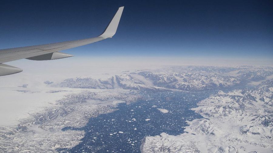 Areas of ice are seen as the airplane carrying U.S. Secretary of State Antony Blinken approaches Kangerlussuaq Airport in Greenland, Thursday, May 20, 2021. Blinken traveled to Greenland for a brief visit to reinforce U.S. commitment to the island. (Saul Loeb/Pool Photo via AP)
