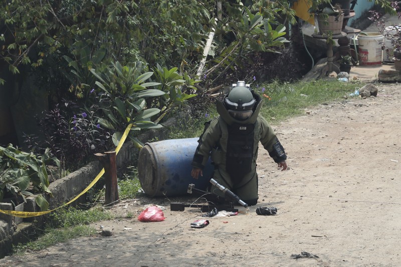 Indonesia Suspicious Package A member of the police bomb disposal squad leave s the scene after destroying a suspicious package found inside a garbage can in Bekasi on the outskirts of Jakarta, Indonesia, Monday, Aug. 23, 2021. Indonesia, the world's most populous Muslim nation, has carried out a sustained crackdown on Islamic militants since bombings on the tourist island of Bali in 2002 killed 202 people, mostly foreigners. Recently, attacks on foreign interests have been largely replaced in recent years by smaller, less deadly strikes targeting the government, mainly police and anti-terrorism forces. (AP Photo/Achmad Ibrahim)