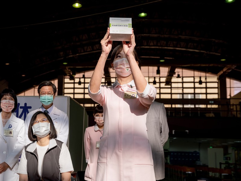 Virus Outbreak Taiwan President In this photo released by the Taiwan Presidential Office, Taiwanese President Tsai Ing-wen, center, receives her first shot of the island's first domestically developed coronavirus vaccine made by Medigen Vaccine Biologics Corp. at the Taiwan University Hospital in Taipei, Taiwan on Monday, Aug. 23, 2021. The vaccine was given emergency approval by regulators in July using a shortcut that prompted fierce opposition from parts of Taiwan's medical and scientific community. (Taiwan Presidential Office via AP)