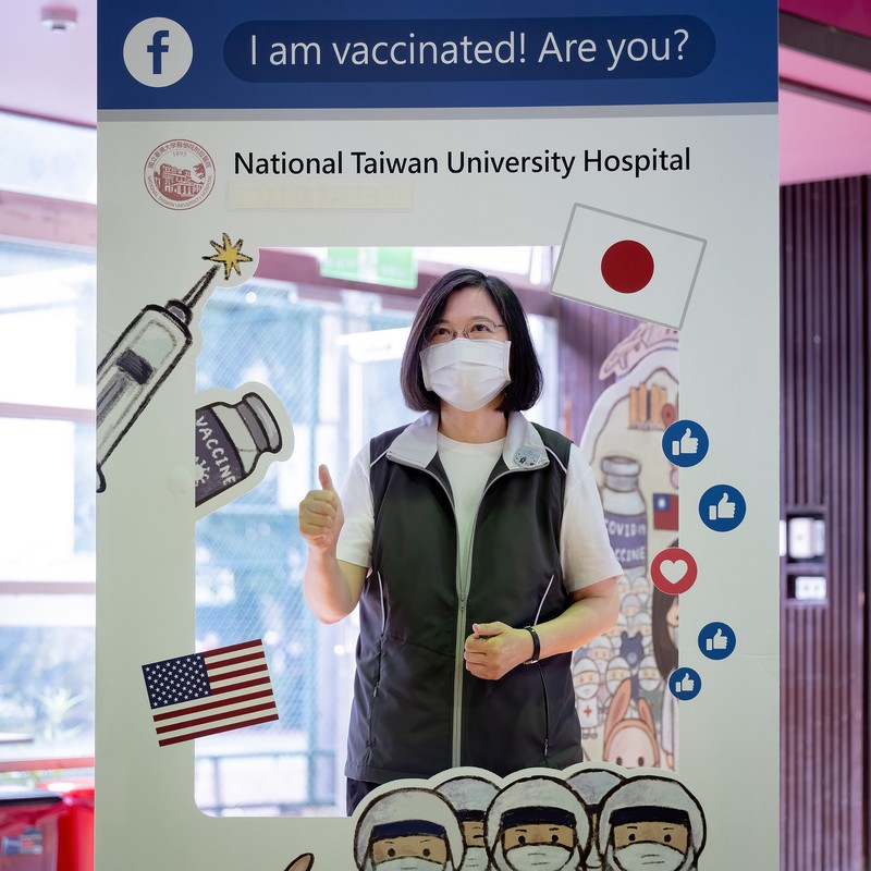 Virus Outbreak Taiwan President In this photo released by the Taiwan Presidential Office, Taiwanese President Tsai Ing-wen, center, receives her first shot of the island's first domestically developed coronavirus vaccine made by Medigen Vaccine Biologics Corp. at the Taiwan University Hospital in Taipei, Taiwan on Monday, Aug. 23, 2021. The vaccine was given emergency approval by regulators in July using a shortcut that prompted fierce opposition from parts of Taiwan's medical and scientific community. (Taiwan Presidential Office via AP)