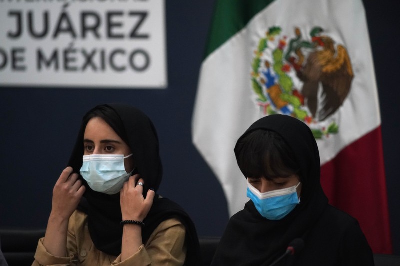 Mexico Afghan All Girls Robotics Team Several of the original members of the Afghan all-girls robotics team, who have received threats from the Taliban, attend a press conference after arriving at the Benito Juarez International Airport in Mexico City, Tuesday, Aug. 24, 2021. After extensive international efforts and coordination from a diverse group of volunteers to evacuate the team, the girls are now begging the international community to help get their family to safety with them. (AP Photo/Eduardo Verdugo)