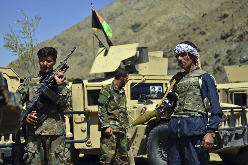 Militiamen loyal to Ahmad Massoud, son of the late Ahmad Shah Massoud, hold their weapons, in Panjshir province northeastern Afghanistan, Thursday, Aug. 26, 2021. The Panjshir Valley is the last region not under Taliban control following their stunning blitz across Afghanistan. Local fighters held off the Soviets in the 1980s and the Taliban a decade later under the leadership of Ahmad Shah Massoud, a guerrilla fighter who attained near-mythic status before he was killed in a suicide bombing. (AP Photo/Jalaluddin Sekandar)