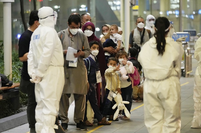 An Afghan girl in a bus waits to leave after arriving with her family at the Incheon International Airport, South Korea, Thursday, Aug. 26, 2021. (AP Photo/Ahn Young-joon)