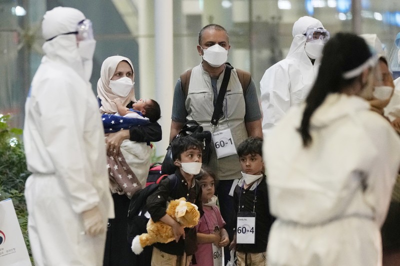 AP Week in Pictures Asia An Afghan girl in a bus waits to leave after arriving with her family at the Incheon International Airport, South Korea, Thursday, Aug. 26, 2021. (AP Photo/Ahn Young-joon)