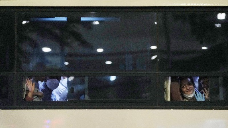An Afghan girl in a bus waits to leave after arriving with her family at the Incheon International Airport, South Korea, Thursday, Aug. 26, 2021. (AP Photo/Ahn Young-joon)