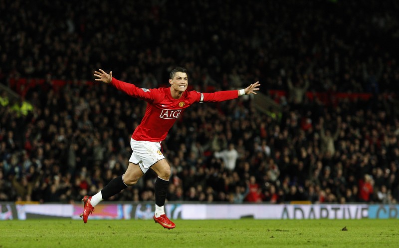 Man United Ronaldo's Return Soccer FILE - In this Aug. 12, 2006, file photo, Manchester United's Cristiano Ronaldo, right, celebrates scoring against Sevilla with Ole Gunnar Solskjaer and Patrice Evra during a soccer match in Manchester, England. Ronaldo is headed back to Manchester United. The English club said Friday, Aug. 27, 2021, it has reached an agreement with Juventus for the transfer of the 36-year-old Portugal forward, subject to agreement of personal terms, visa and a medical examination. (Martin Rickett/PA via AP)