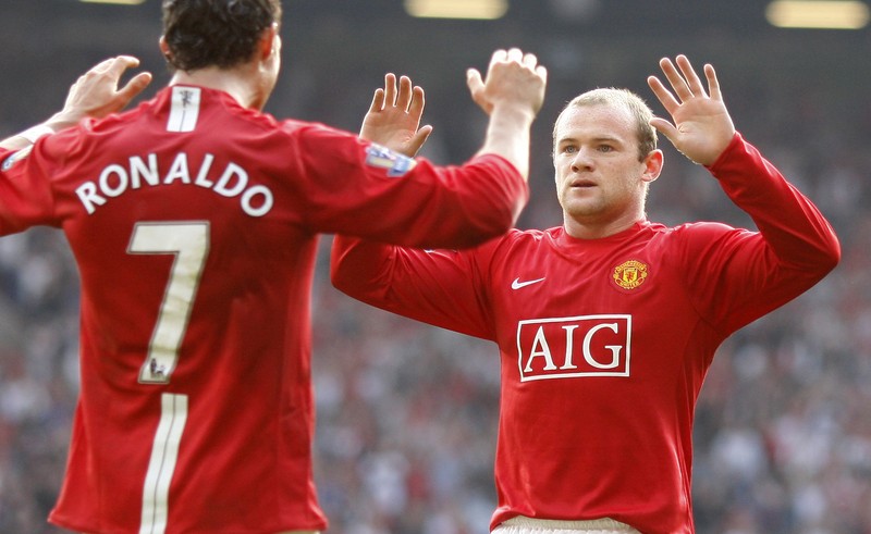 Man United Ronaldo's Return Soccer FILE - In this Aug. 12, 2006, file photo, Manchester United's Cristiano Ronaldo, right, celebrates scoring against Sevilla with Ole Gunnar Solskjaer and Patrice Evra during a soccer match in Manchester, England. Ronaldo is headed back to Manchester United. The English club said Friday, Aug. 27, 2021, it has reached an agreement with Juventus for the transfer of the 36-year-old Portugal forward, subject to agreement of personal terms, visa and a medical examination. (Martin Rickett/PA via AP)