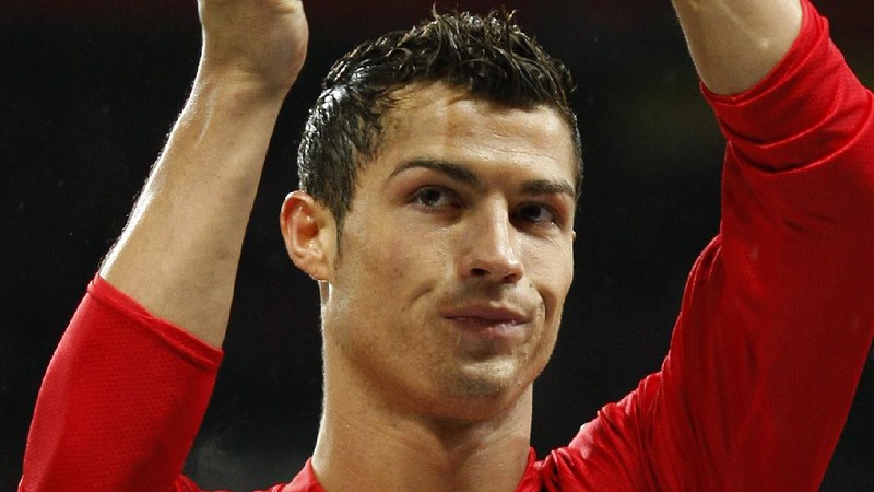 FILE - In this Aug. 12, 2006, file photo, Manchester United's Cristiano Ronaldo, right, celebrates scoring against Sevilla with Ole Gunnar Solskjaer and Patrice Evra during a soccer match in Manchester, England. Ronaldo is headed back to Manchester United. The English club said Friday, Aug. 27, 2021, it has reached an agreement with Juventus for the transfer of the 36-year-old Portugal forward, subject to agreement of personal terms, visa and a medical examination. (Martin Rickett/PA via AP)