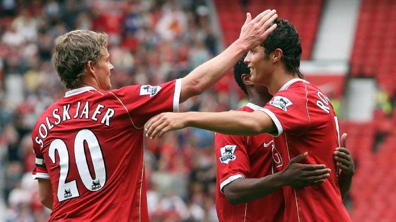 FILE - In this Aug. 12, 2006, file photo, Manchester United's Cristiano Ronaldo, right, celebrates scoring against Sevilla with Ole Gunnar Solskjaer and Patrice Evra during a soccer match in Manchester, England. Ronaldo is headed back to Manchester United. The English club said Friday, Aug. 27, 2021, it has reached an agreement with Juventus for the transfer of the 36-year-old Portugal forward, subject to agreement of personal terms, visa and a medical examination. (Martin Rickett/PA via AP)