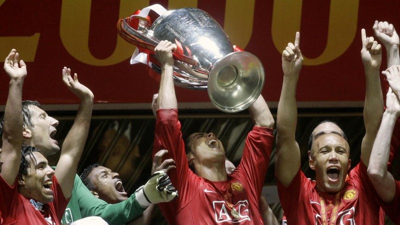 FILE - In this Aug. 12, 2006, file photo, Manchester United's Cristiano Ronaldo, right, celebrates scoring against Sevilla with Ole Gunnar Solskjaer and Patrice Evra during a soccer match in Manchester, England. Ronaldo is headed back to Manchester United. The English club said Friday, Aug. 27, 2021, it has reached an agreement with Juventus for the transfer of the 36-year-old Portugal forward, subject to agreement of personal terms, visa and a medical examination. (Martin Rickett/PA via AP)