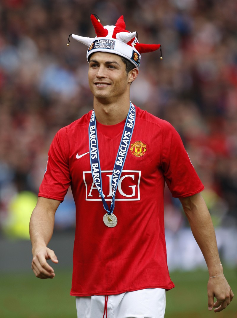 Man United Ronaldo's Return Soccer FILE - In this Aug. 12, 2006, file photo, Manchester United's Cristiano Ronaldo, right, celebrates scoring against Sevilla with Ole Gunnar Solskjaer and Patrice Evra during a soccer match in Manchester, England. Ronaldo is headed back to Manchester United. The English club said Friday, Aug. 27, 2021, it has reached an agreement with Juventus for the transfer of the 36-year-old Portugal forward, subject to agreement of personal terms, visa and a medical examination. (Martin Rickett/PA via AP)