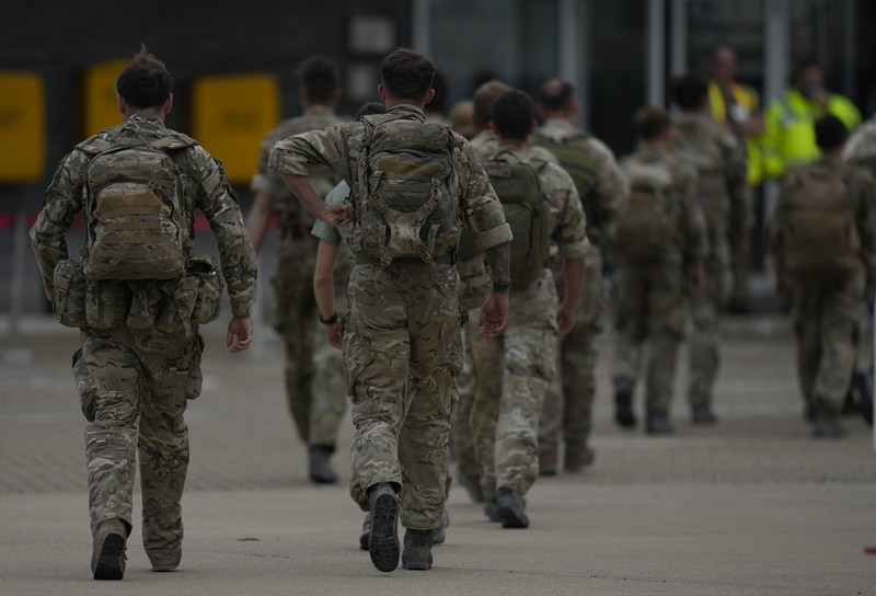 In this handout photo provided by the Ministry of Defence, UK military personnel onboard a A400M aircraft departing Kabul, Afghanistan, Saturday, Aug. 28, 2021. Britain has ended evacuation flights from Kabul airport and begun bringing U.K. troops home. Britain’s defense ministry said the final flight for Afghan citizens had left Kabul. Further flights over the weekend will bring home British troops and diplomats and a few remaining civilians. (Jonathan Gifford/Ministry of Defence via AP)