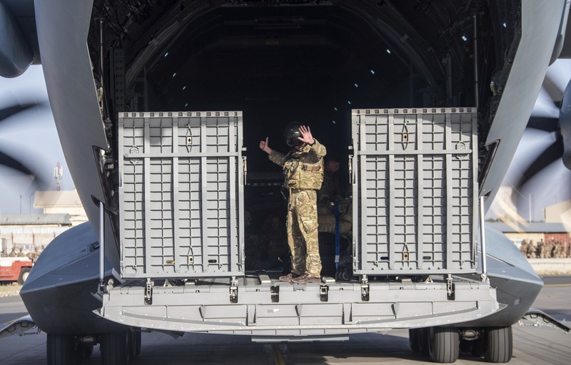 In this handout photo provided by the Ministry of Defence, UK military personnel onboard a A400M aircraft departing Kabul, Afghanistan, Saturday, Aug. 28, 2021. Britain has ended evacuation flights from Kabul airport and begun bringing U.K. troops home. Britain’s defense ministry said the final flight for Afghan citizens had left Kabul. Further flights over the weekend will bring home British troops and diplomats and a few remaining civilians. (Jonathan Gifford/Ministry of Defence via AP)