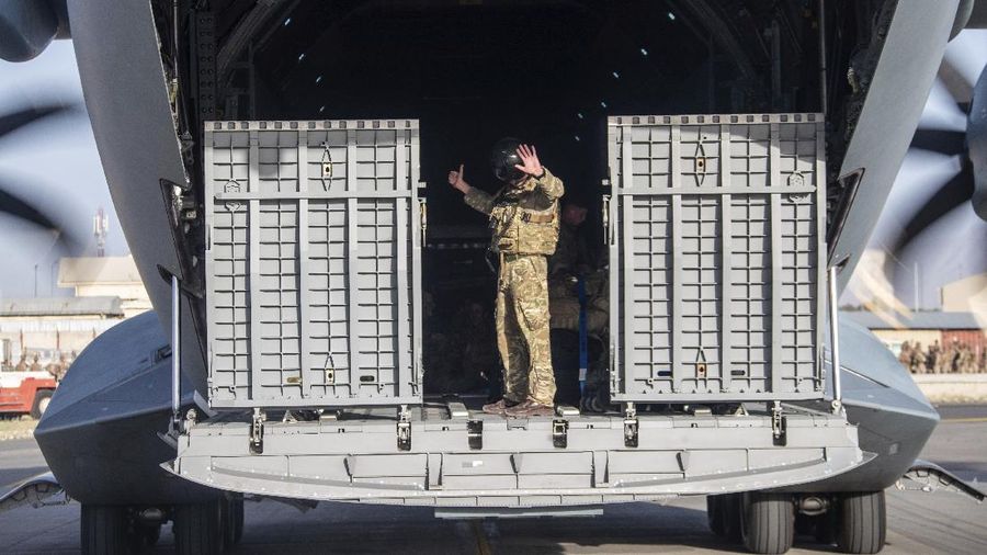 In this handout photo provided by the Ministry of Defence, UK military personnel onboard a A400M aircraft departing Kabul, Afghanistan, Saturday, Aug. 28, 2021. Britain has ended evacuation flights from Kabul airport and begun bringing U.K. troops home. Britain’s defense ministry said the final flight for Afghan citizens had left Kabul. Further flights over the weekend will bring home British troops and diplomats and a few remaining civilians. (Jonathan Gifford/Ministry of Defence via AP)