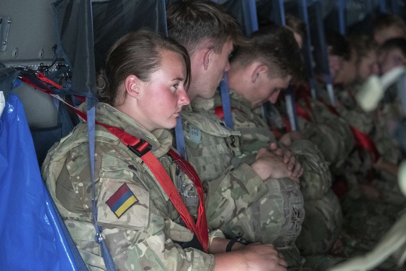 In this handout photo provided by the Ministry of Defence, UK military personnel onboard a A400M aircraft departing Kabul, Afghanistan, Saturday, Aug. 28, 2021. Britain has ended evacuation flights from Kabul airport and begun bringing U.K. troops home. Britain’s defense ministry said the final flight for Afghan citizens had left Kabul. Further flights over the weekend will bring home British troops and diplomats and a few remaining civilians. (Jonathan Gifford/Ministry of Defence via AP)