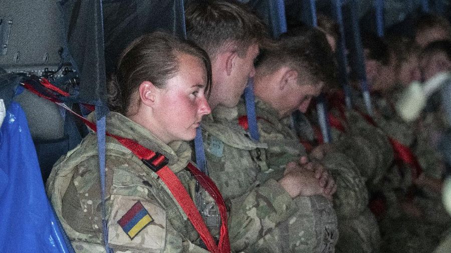 In this handout photo provided by the Ministry of Defence, UK military personnel onboard a A400M aircraft departing Kabul, Afghanistan, Saturday, Aug. 28, 2021. Britain has ended evacuation flights from Kabul airport and begun bringing U.K. troops home. Britain’s defense ministry said the final flight for Afghan citizens had left Kabul. Further flights over the weekend will bring home British troops and diplomats and a few remaining civilians. (Jonathan Gifford/Ministry of Defence via AP)