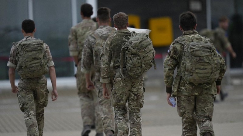In this handout photo provided by the Ministry of Defence, UK military personnel onboard a A400M aircraft departing Kabul, Afghanistan, Saturday, Aug. 28, 2021. Britain has ended evacuation flights from Kabul airport and begun bringing U.K. troops home. Britain’s defense ministry said the final flight for Afghan citizens had left Kabul. Further flights over the weekend will bring home British troops and diplomats and a few remaining civilians. (Jonathan Gifford/Ministry of Defence via AP)
