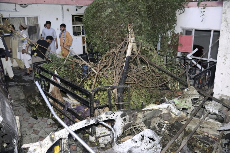 A destroyed vehicle is seen inside a house after a U.S. drone strike in Kabul, Afghanistan, Sunday, Aug. 29, 2021. A U.S. drone strike destroyed a vehicle carrying 