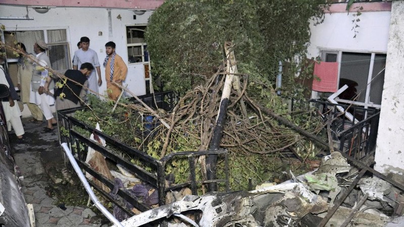 A destroyed vehicle is seen inside a house after a U.S. drone strike in Kabul, Afghanistan, Sunday, Aug. 29, 2021. A U.S. drone strike destroyed a vehicle carrying 