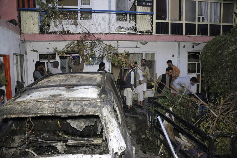 A destroyed vehicle is seen inside a house after a U.S. drone strike in Kabul, Afghanistan, Sunday, Aug. 29, 2021. A U.S. drone strike destroyed a vehicle carrying 