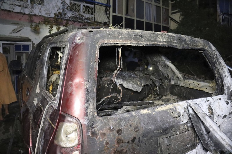 A destroyed vehicle is seen inside a house after a U.S. drone strike in Kabul, Afghanistan, Sunday, Aug. 29, 2021. A U.S. drone strike destroyed a vehicle carrying 