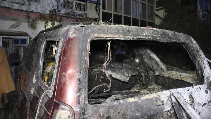 A destroyed vehicle is seen inside a house after a U.S. drone strike in Kabul, Afghanistan, Sunday, Aug. 29, 2021. A U.S. drone strike destroyed a vehicle carrying 