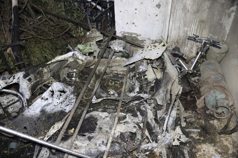A destroyed vehicle is seen inside a house after a U.S. drone strike in Kabul, Afghanistan, Sunday, Aug. 29, 2021. A U.S. drone strike destroyed a vehicle carrying 