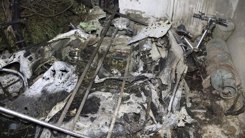 A destroyed vehicle is seen inside a house after a U.S. drone strike in Kabul, Afghanistan, Sunday, Aug. 29, 2021. A U.S. drone strike destroyed a vehicle carrying 