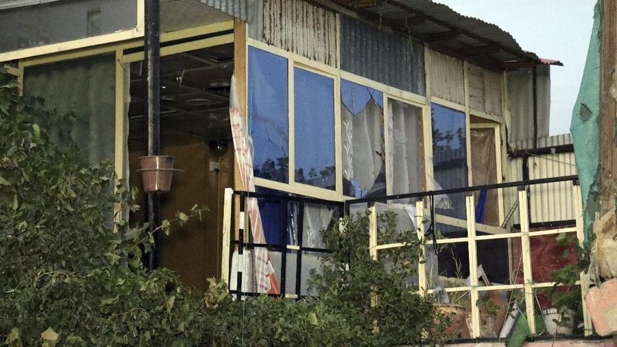 A destroyed vehicle is seen inside a house after a U.S. drone strike in Kabul, Afghanistan, Sunday, Aug. 29, 2021. A U.S. drone strike destroyed a vehicle carrying 